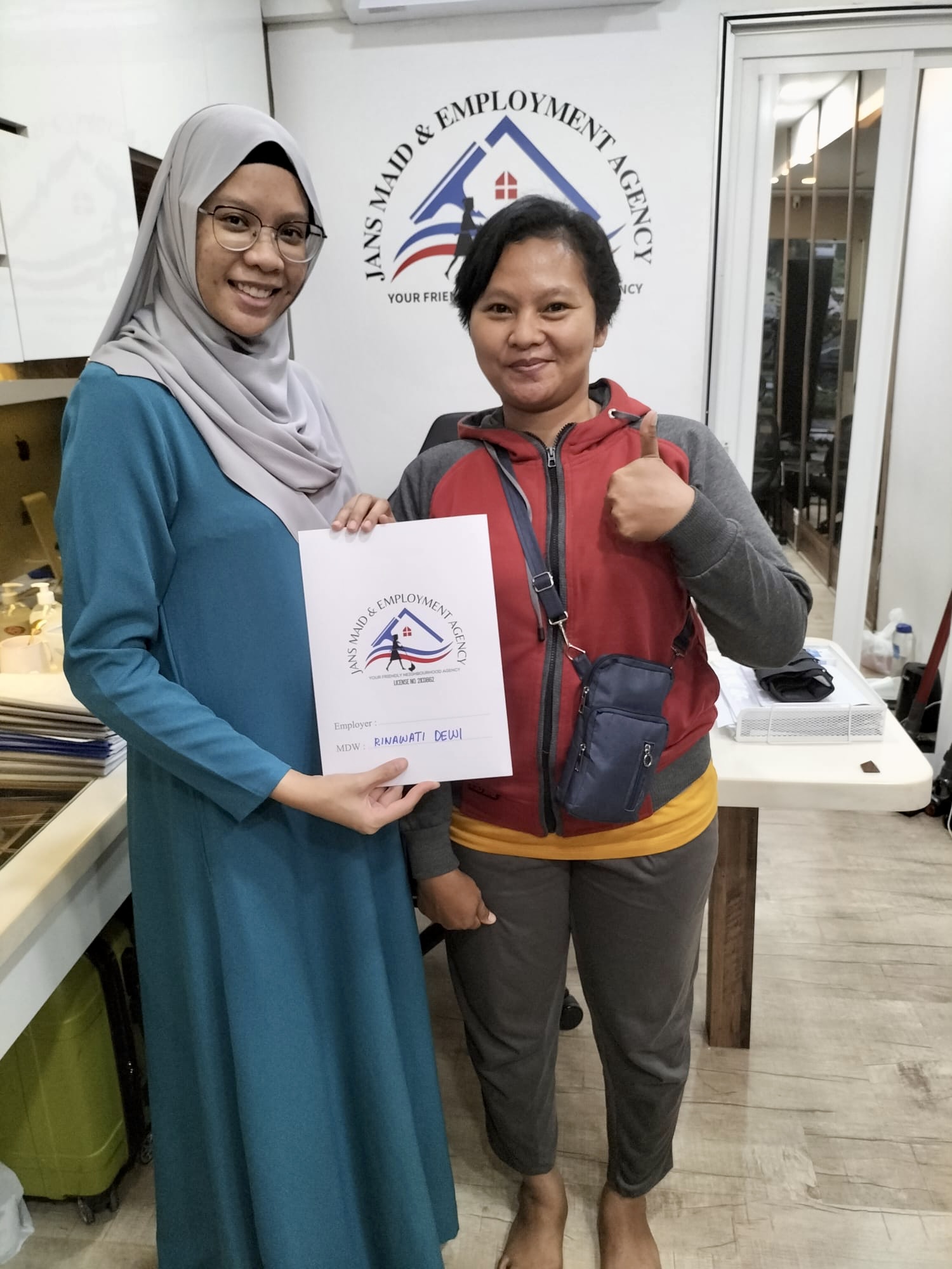 Smiling clients in Jans Maid Singapore office