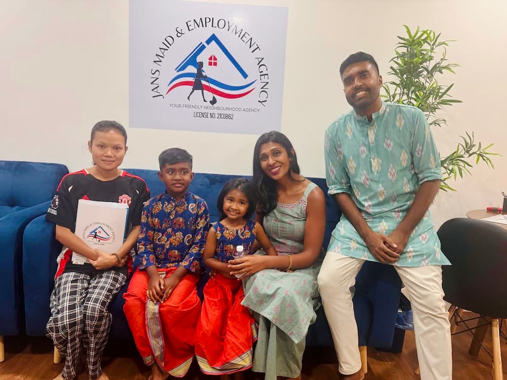 Family with Myanmar domestic helper at agency office